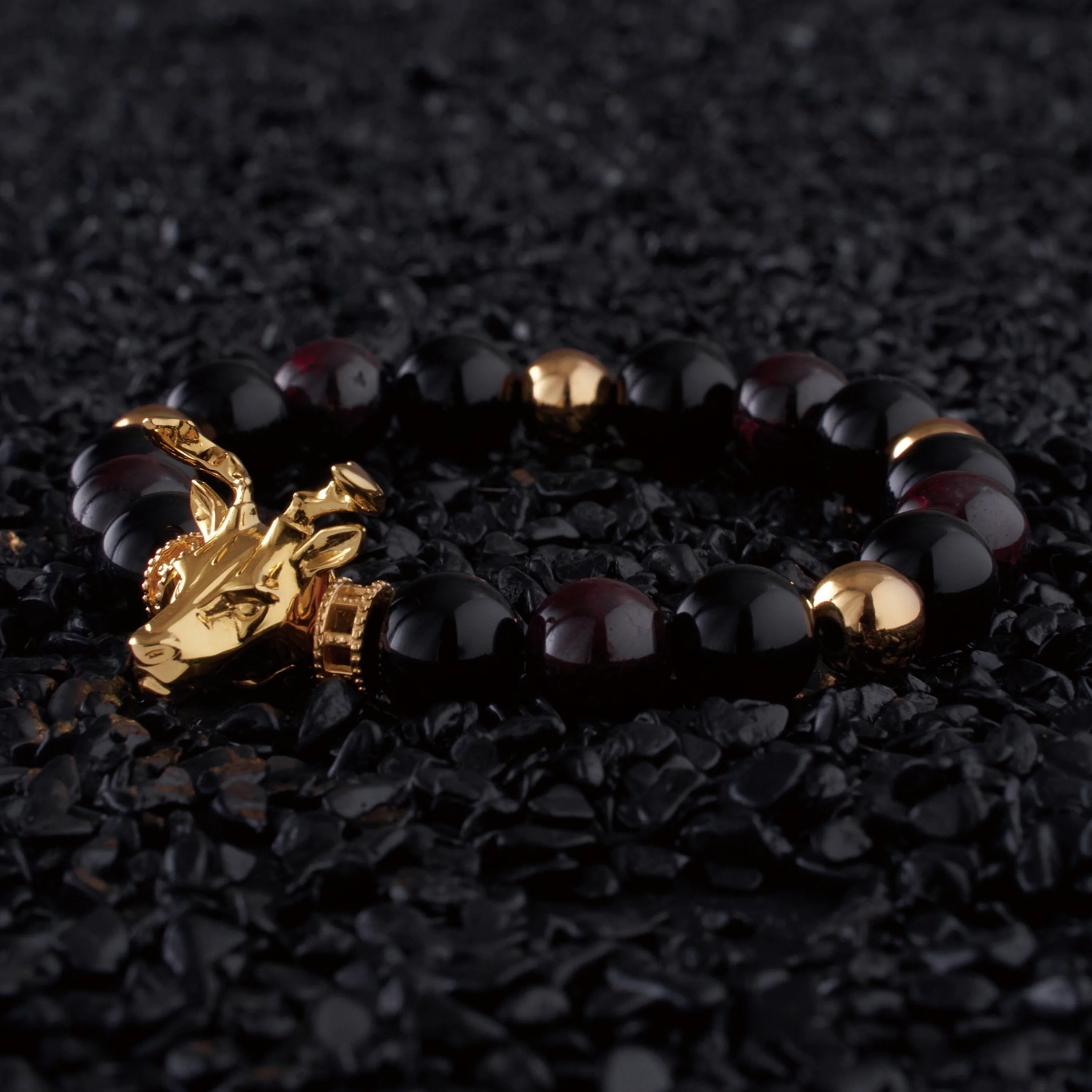 Gold Deer, obsidian, garnet bracelet with gold connector